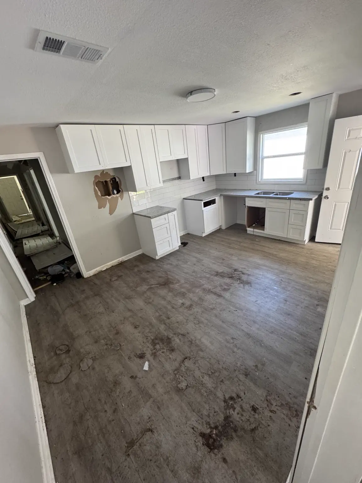 Same Alexandria kitchen after household debris was removed